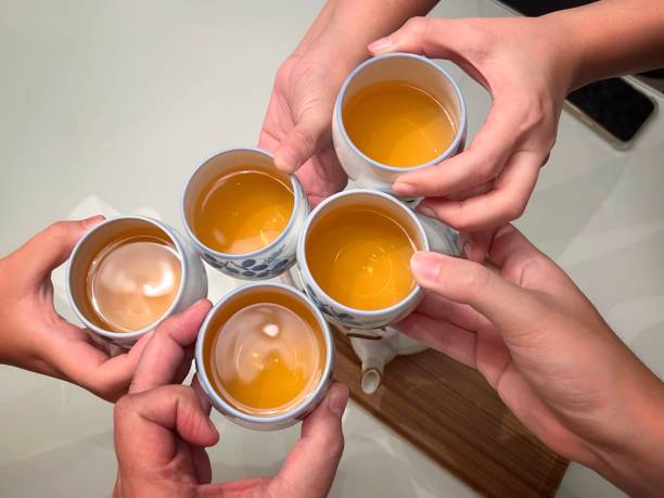 istock Hands holding Chinese teacup to toast 2149527607