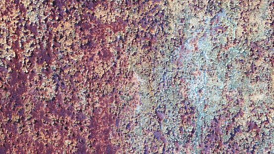 This pipe shows texture and is rusty with bolts. This could be used as a background. The metal industrial look of steal or metal that is aged.