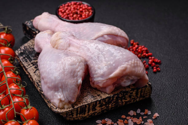 istock Fresh raw chicken legs with salt and spices 2149528450