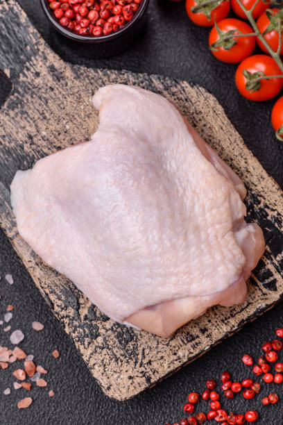 istock Fresh raw chicken thighs with salt and spices 2149528834