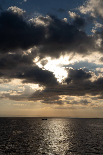 Lonely boat on the mediterranean Sea at sunset. HDR - high dynamic range