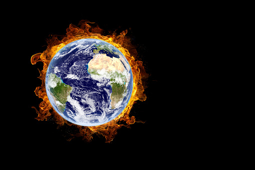 Earth burning in flames concept of global warming and catastrophe. This image elements furnished by NASA.