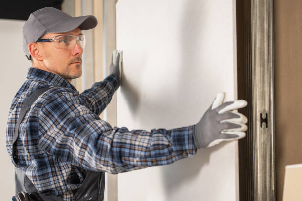 istock Worker Installing Another Sheet of a Drywall 2149530650
