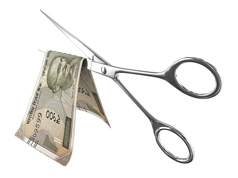 Indian rupee money falling finance crisis recession scissors