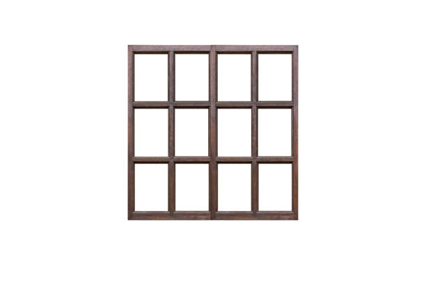 istock Old dark-colored brown wooden window frame with many sashes  isolated on white background. 2149531205