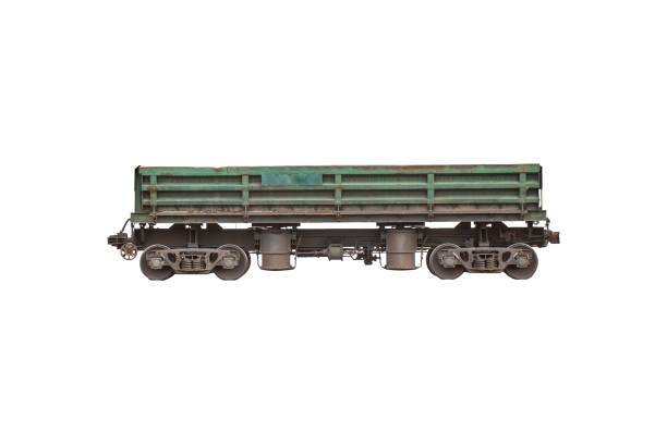 Green metallic goods wagon or freight wagon isolated on white. Unpowered railway vehicles that are used for the transportation of cargo.