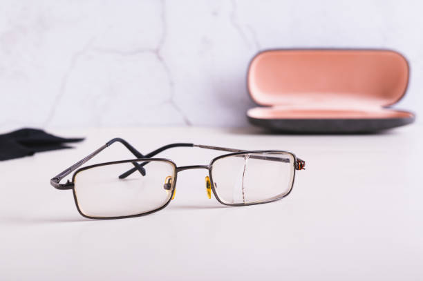 istock Old broken broken glasses on the table against the background of an open hard case 2149533162
