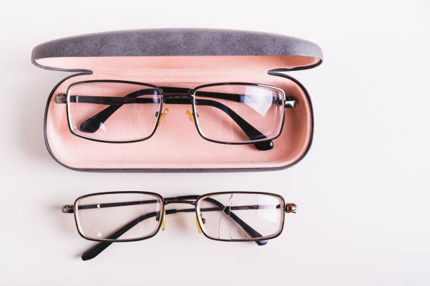 istock Whole glasses in a hard case and broken glasses on the table top view 2149533183