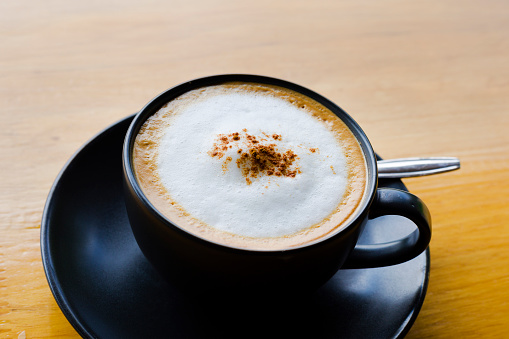 Close-up of cup of cappuccino with cinnamon