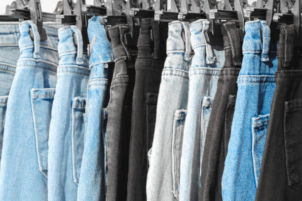 istock Denim trousers hanging in a store 2149534686
