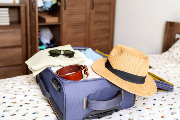 istock Packing a travel bag. Preparing baggage for the trip. 2149534990