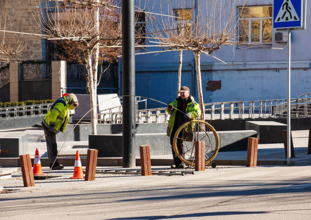 Dnepr, Ukraine - 02.15.2022: Workers are laying cables on a city street.