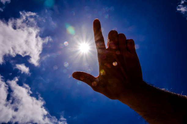 istock A hand is pointing up at the sun 2149537538