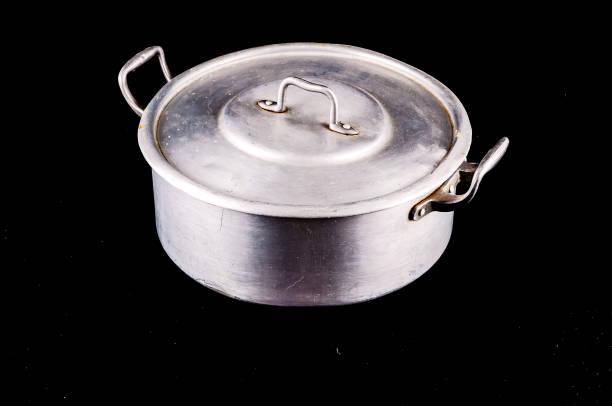 istock A silver pot with a lid sits on a black background 2149537561