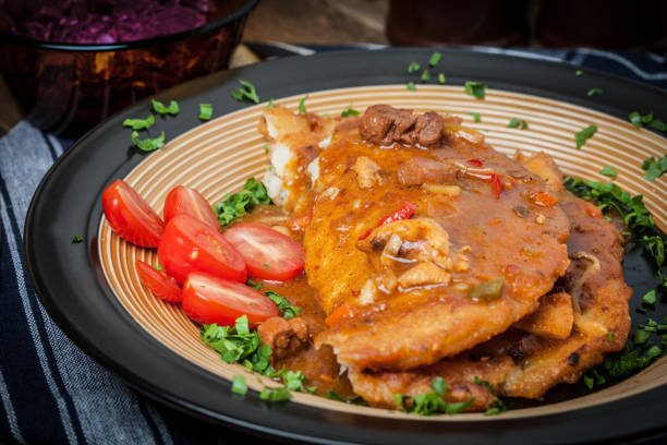 Potato pancakes with meat, vegetable, tomato and parsley. Selective focus.