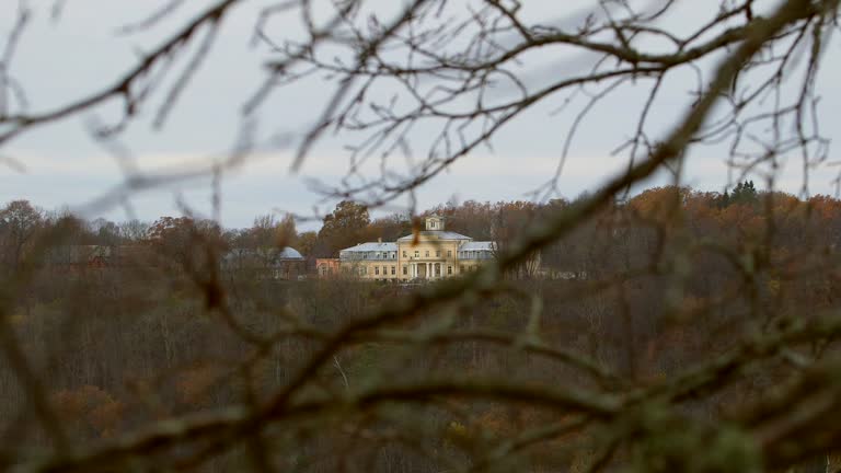 Renaissance Krimulda Manor Across the Valley Among Autumnal Trees.