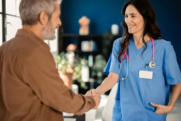 istock Female doctor welcoming her patient 2149539659