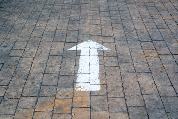 Arrow on the road and white color background