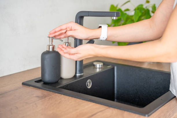 istock A woman uses soap or detergent from a reusable bottle. Eco-friendly lifestyle 2149540637
