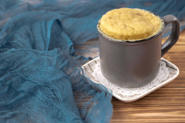 istock vanilla mugcake is microwaved. Homemade cupcake in a coffee mug. 2149540994