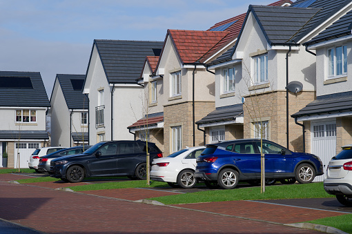 New housing development and owners cars parked outside UK