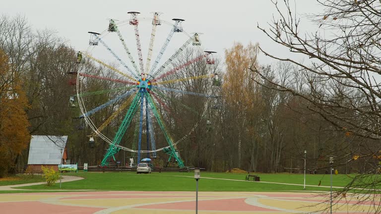 Colorful Ferris Wheel Turns Slowly on the Outskirts of Sigulda in Late Autumn.