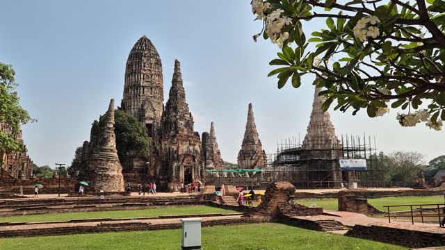 Wat Chaiwatthanaram The Ayutthaya Historical Park is a popular place for tourists to come and visit wearing traditional Thai costumes.