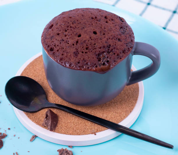 istock mugcake is microwaved. Homemade cupcake in a mug is on a plate. 2149541893