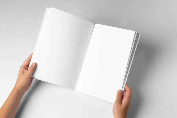 istock Empty Book Template on White Background, hands Open book with blank pages. Mock up for design 2149544664