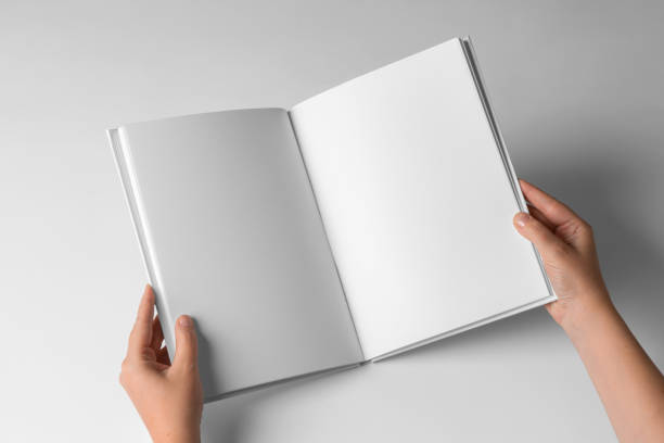 istock Empty Book Template on White Background, hands Open book with blank pages. Mock up for design 2149544665
