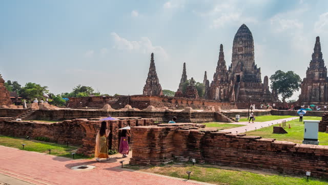 Timelapse of Wat Chaiwatthanaram The Ayutthaya Historical Park is a popular place for tourists to come and visit wearing traditional Thai costumes.