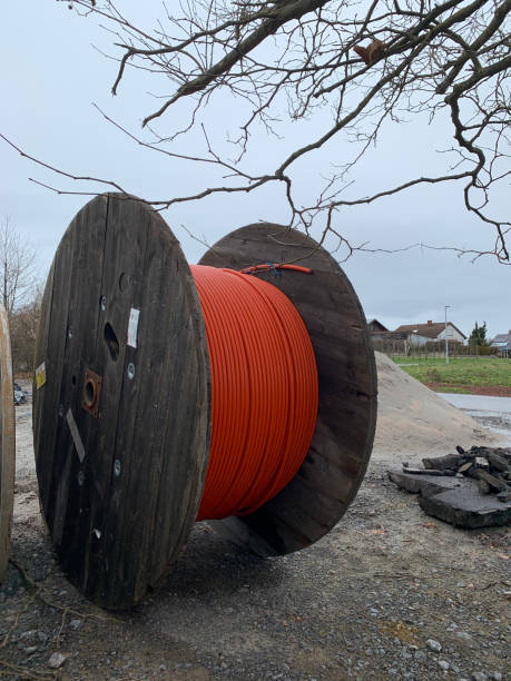 istock A wooden reels with an orange cable on a construction site. 2149546463