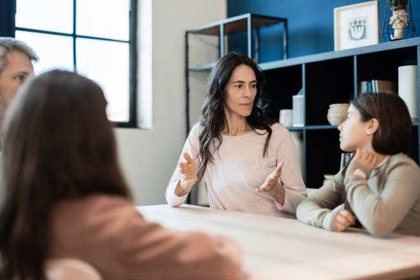 istock Mother solving some problems with her two teenage girls 2149548178