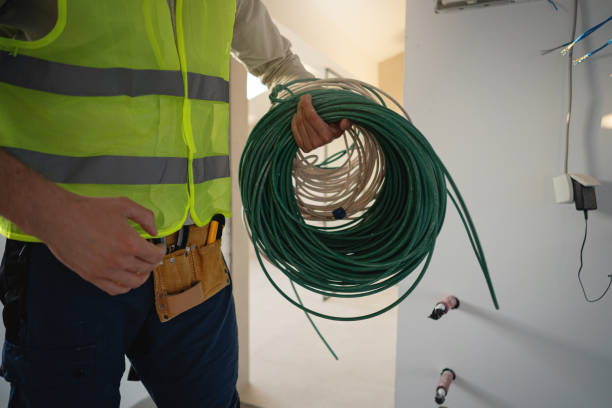 istock Unrecognizable professional electrician holding coiled electrical cables around his arm 2149549058