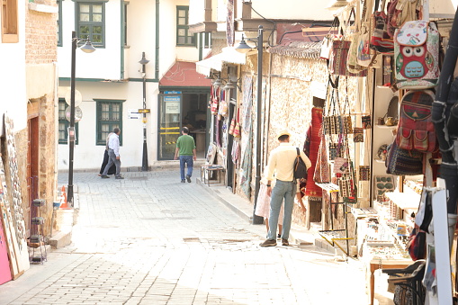 Antalya, Turkey - November, 3, 2023:  Man shopping in the traditional shop in the old town of Antalya.