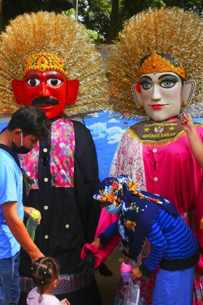 Jakarta, March 10, 2021: Ondel-ondel is a Betawi performing art form in Jakarta Ondel-ondel is a typical Betawi performing art form in Jakarta which is often performed at people's parties. ondel ondel betawi stock pictures, royalty-free photos & images
