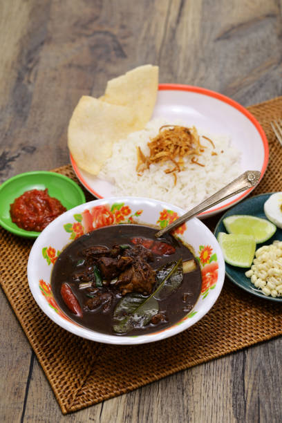 istock nasi rawon, Indonesian black beef soup with rice. 2149553440