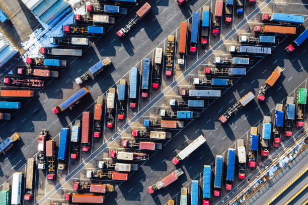 istock Aerial View, Rows of Trucks Driving in Harbor with Trailers 2149554167