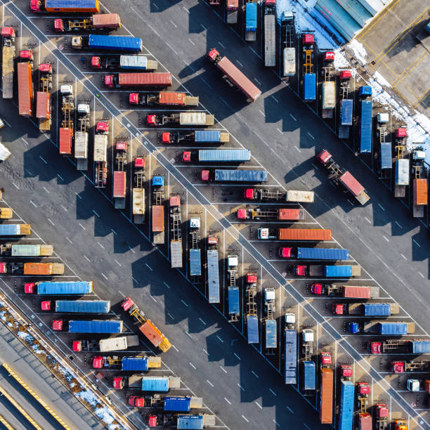 istock Aerial View, Rows of Trucks Driving in Harbor with Trailers 2149554209