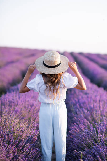 istock Child girl resting in lavender meadow 2149554310