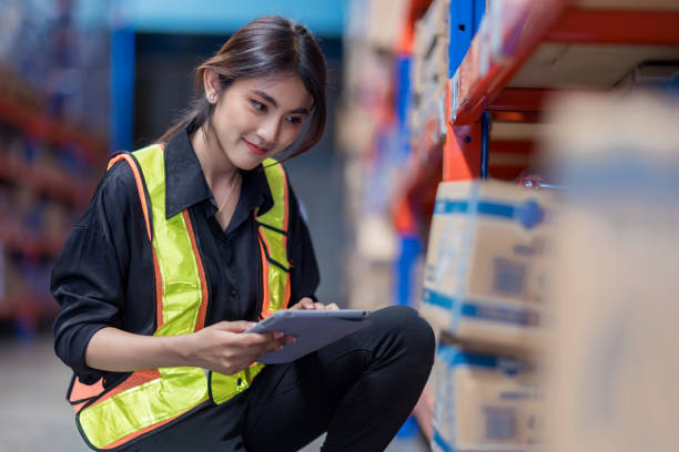 istock Warehouse worker working in warehouse storage. Foreman or worker work at factory site check up products in site. Inventory worker working in  factory Storehouse 2149556963