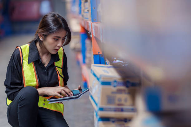 istock Warehouse worker working in warehouse storage. Foreman or worker work at factory site check up products in site. Inventory worker working in  factory Storehouse 2149556975