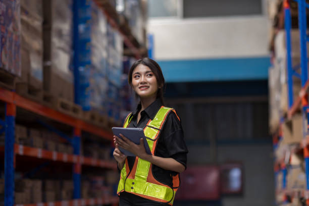 istock Warehouse worker working in warehouse storage. Foreman or worker work at factory site check up products in site. Inventory worker working in  factory Storehouse 2149556977