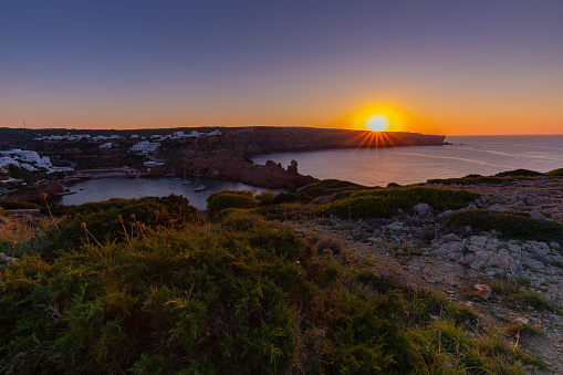 Sea landscape and rocky coast, relaxation and sunset, nice and warm evening on a Spanish island, shot against the background of nature, Menorca