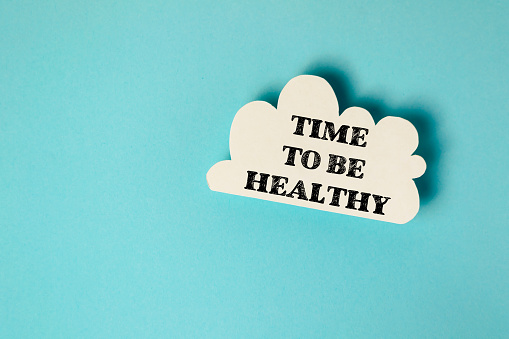 A cloud with the words Time to be healthy written on it. Concept of motivation and encouragement to prioritize one's health and well-being