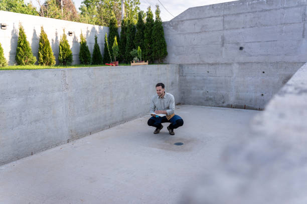 istock Master engineer inspecting the construction of a luxurious yard and swimming pool 2149559766