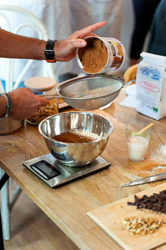 Mixing the chocolate powder with the flour for the bread