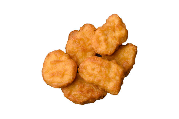 istock Delicious fresh crispy chicken nuggets on a dark concrete background 2149562778