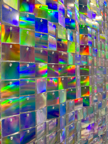 Close-up of a vibrant glass mosaic with a dazzling display of reflective colors, ideal for unique background textures or abstract art concepts