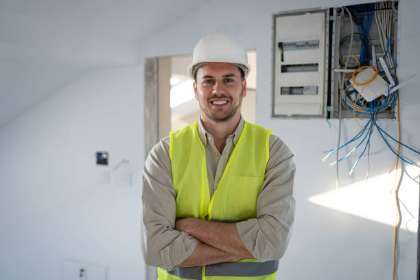 Portrait of smiling Caucasian male electrician stock photo